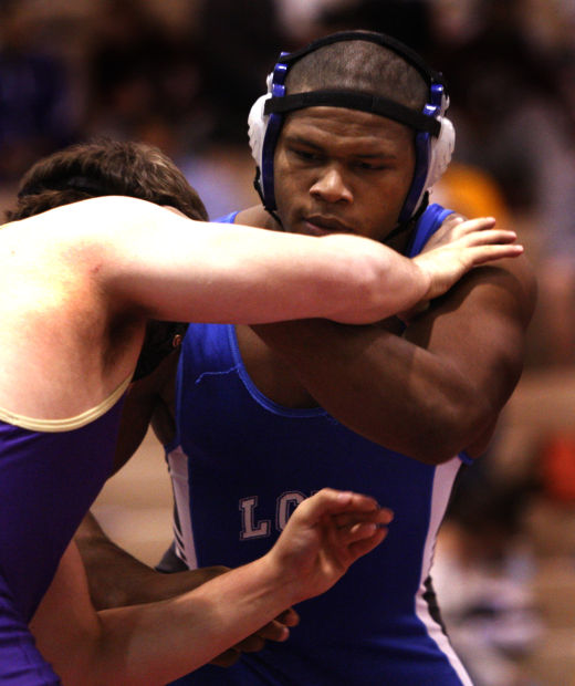 Lake Central's Gelen Robinson breaks a hold by Hobart's Jon Ramirez during Saturday's semifinals of the Lake County Championships.